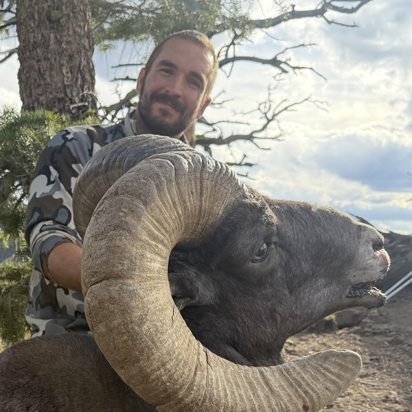 Zachary Thompson with a bighorn ram he took this season